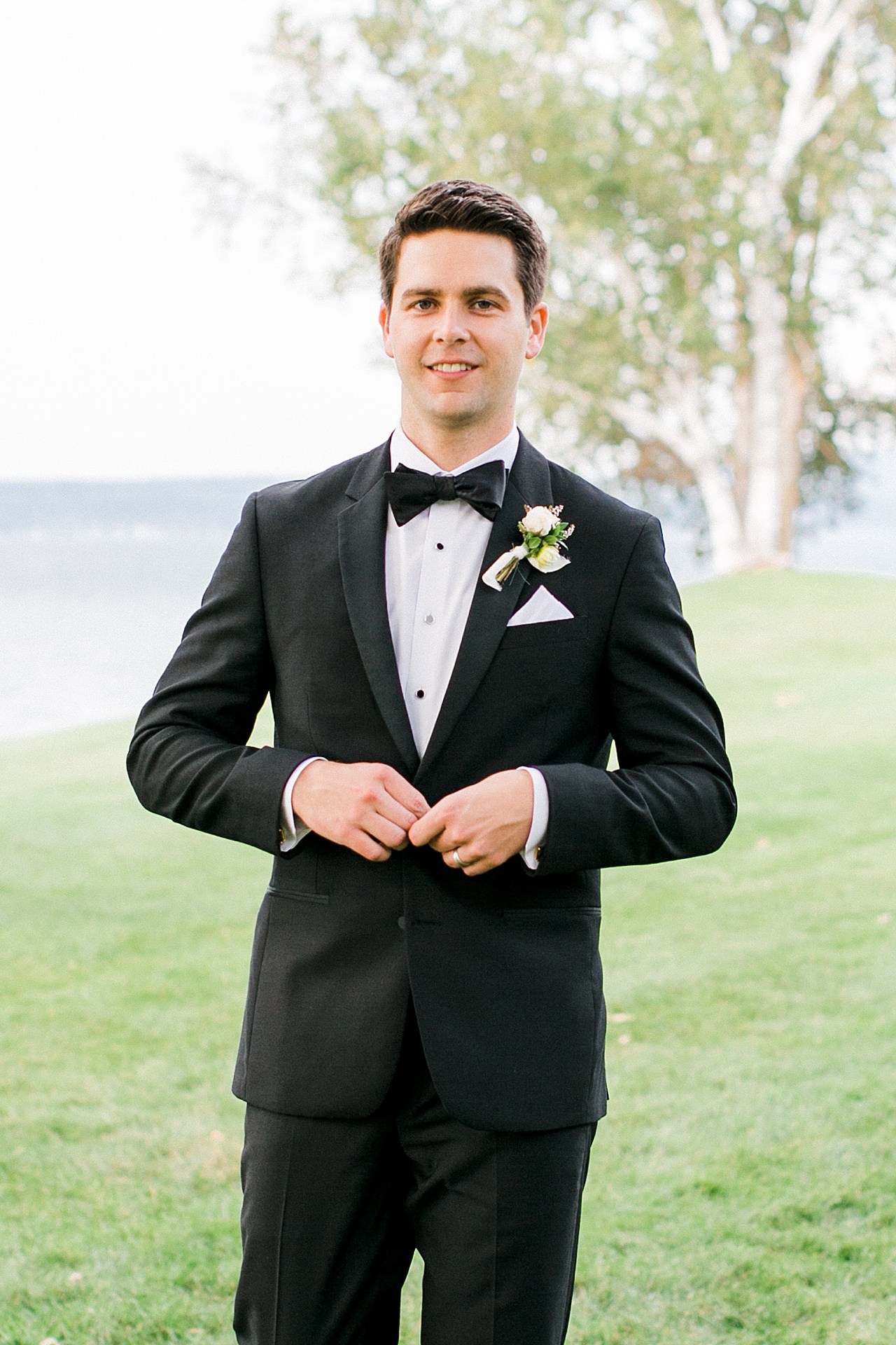 A groom smiling on his wedding day