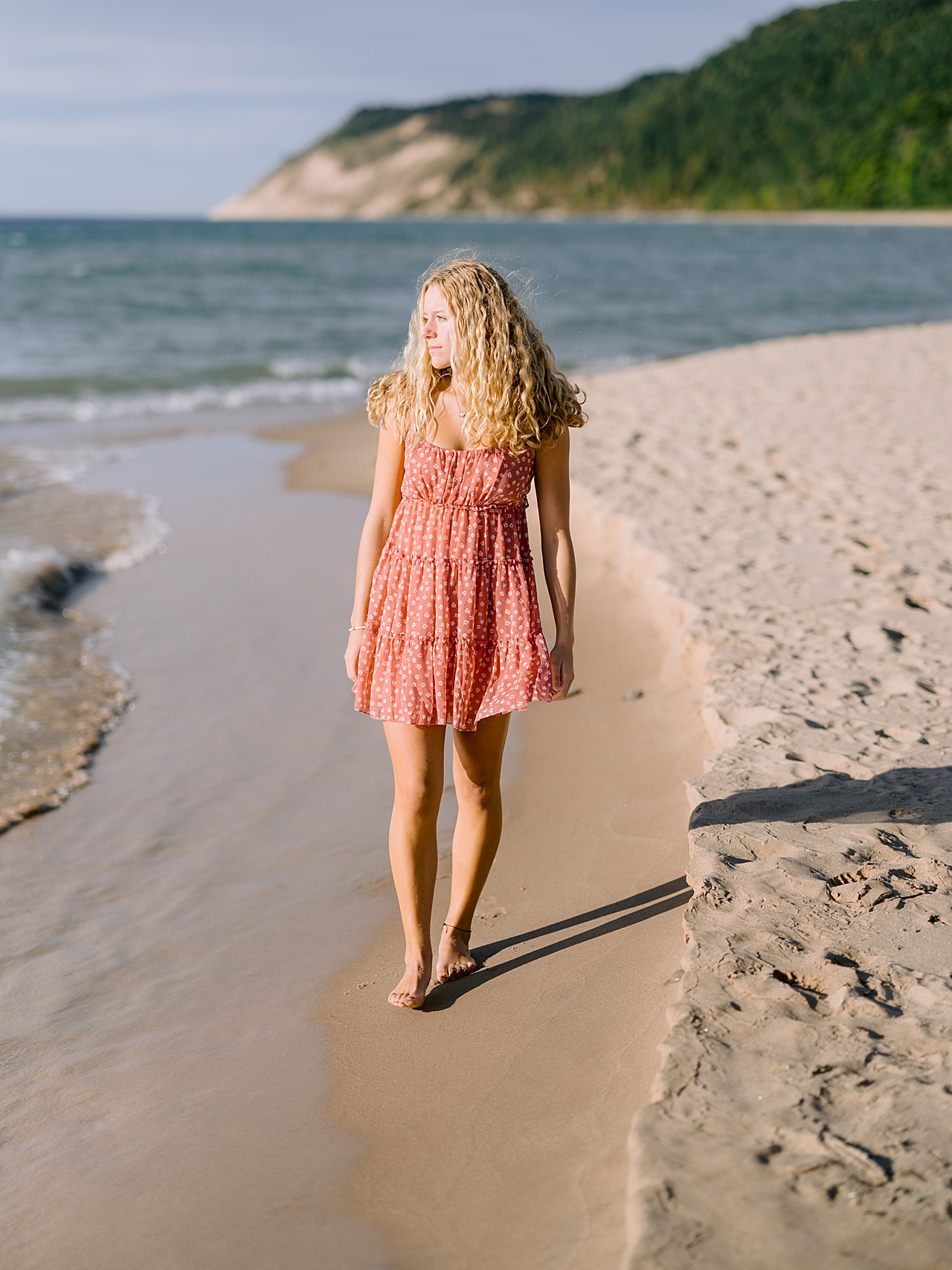 A high school senior portrait of a girl on a beach near Sleeping Bear Dunes