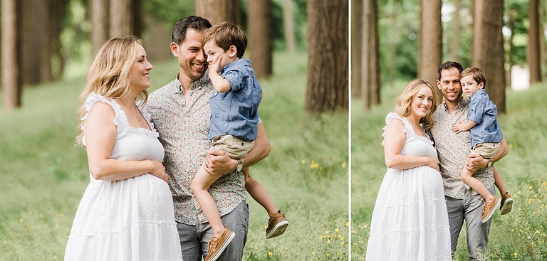 A family of three poses for portraits in the woods near Charlevoix, Michigan