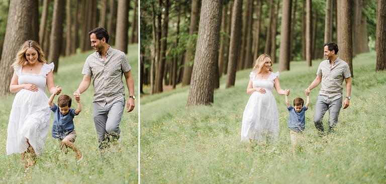 A family of three walks through a field of little yellow flowers near Charlevoix Michigan