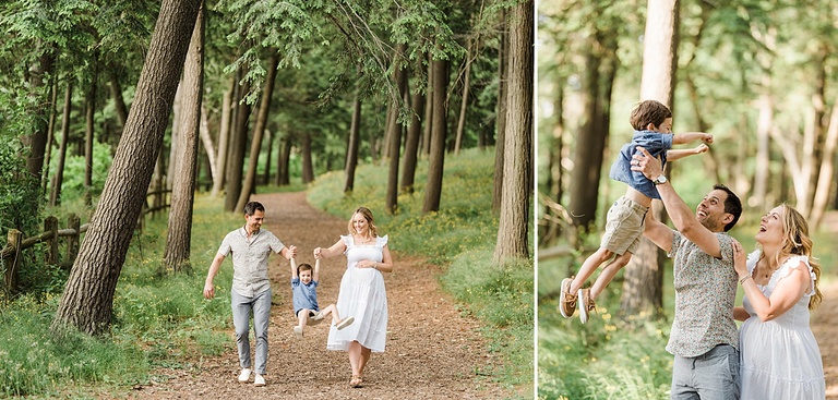 A man throws his son into the air while the mother smiles and laughs