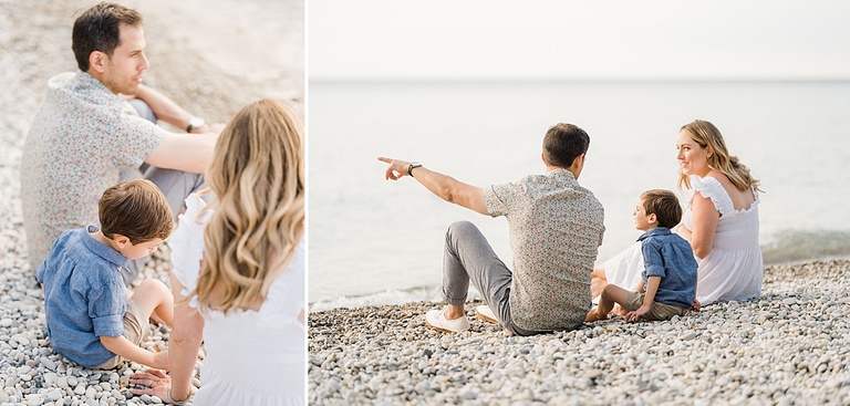 A family of three sit on a Michigan beach together while the man points out across the lake