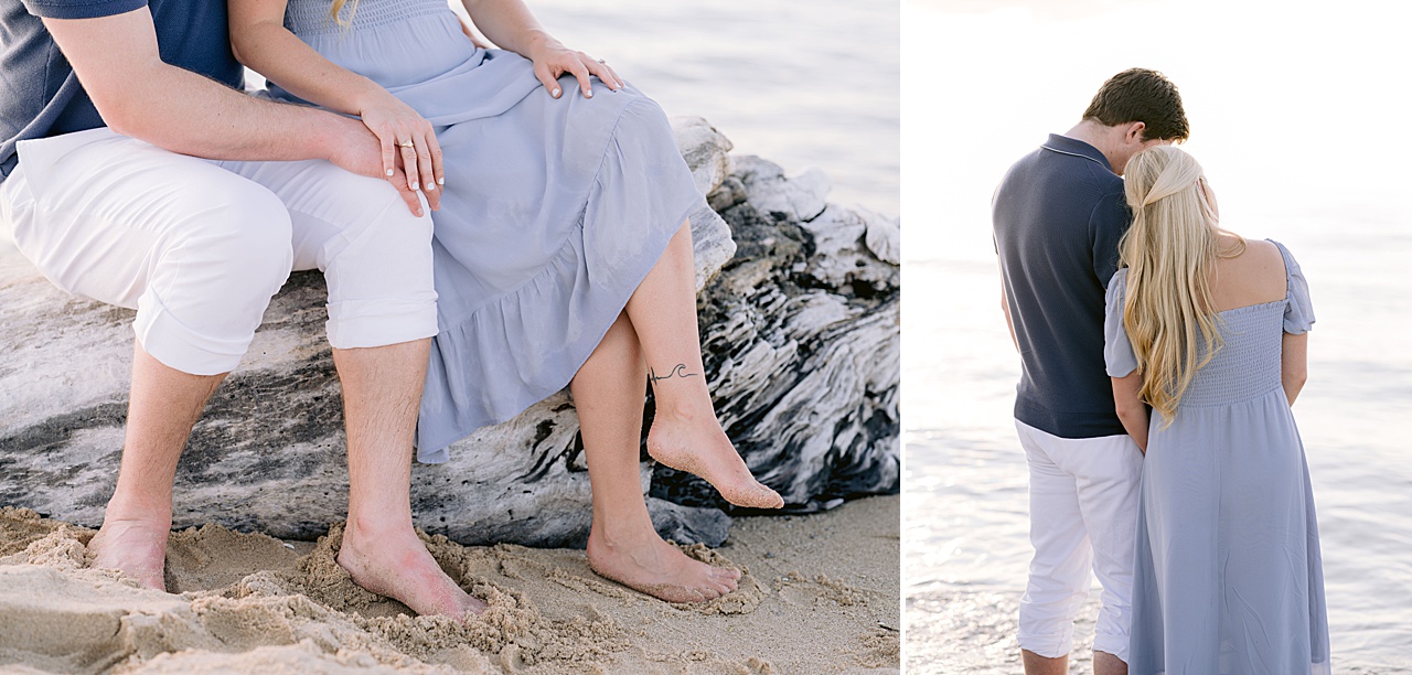 A couple sitting on a large driftwood tree in Northern Michigan