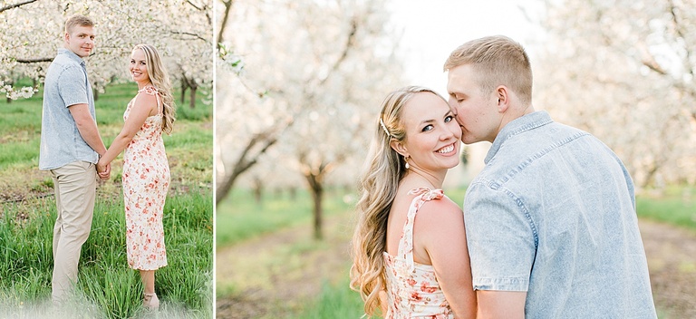 A man kisses his fiancé on the cheek while she looks back over her shoulder and smiles