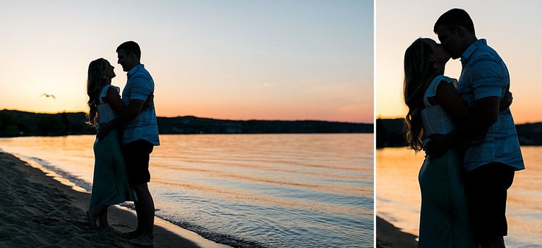 Engagement silhouettes of a couple in Traverse City Michigan during a warm sunset in the spring