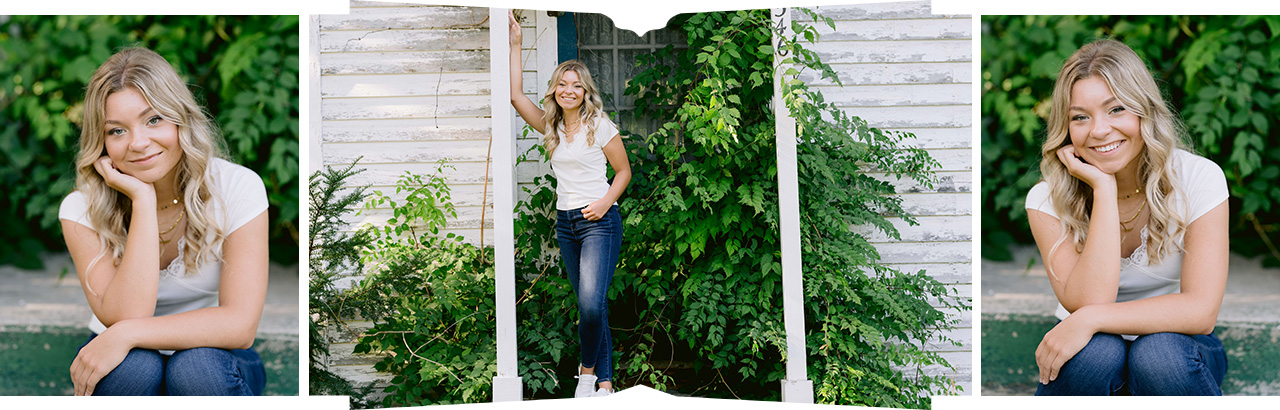 A girl leans against the posts of an old house covered in vines for senior photos