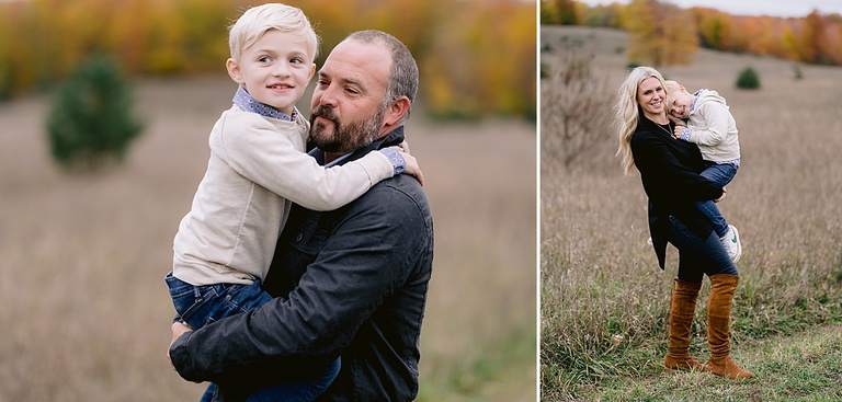 Two parents hold their children and pose for michigan fall family portraits