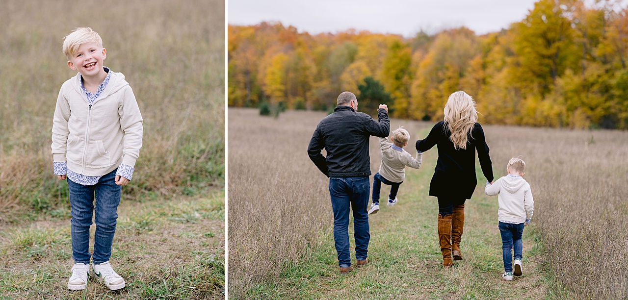 A mother and father hold their son's hands and swing him through the air