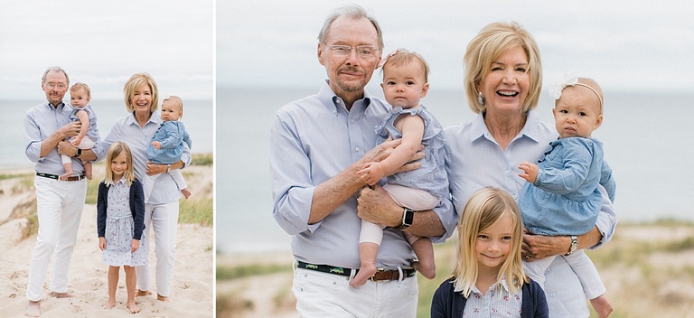 A portrait of a grandmother and grandfather posing with their grandchildren on a beach