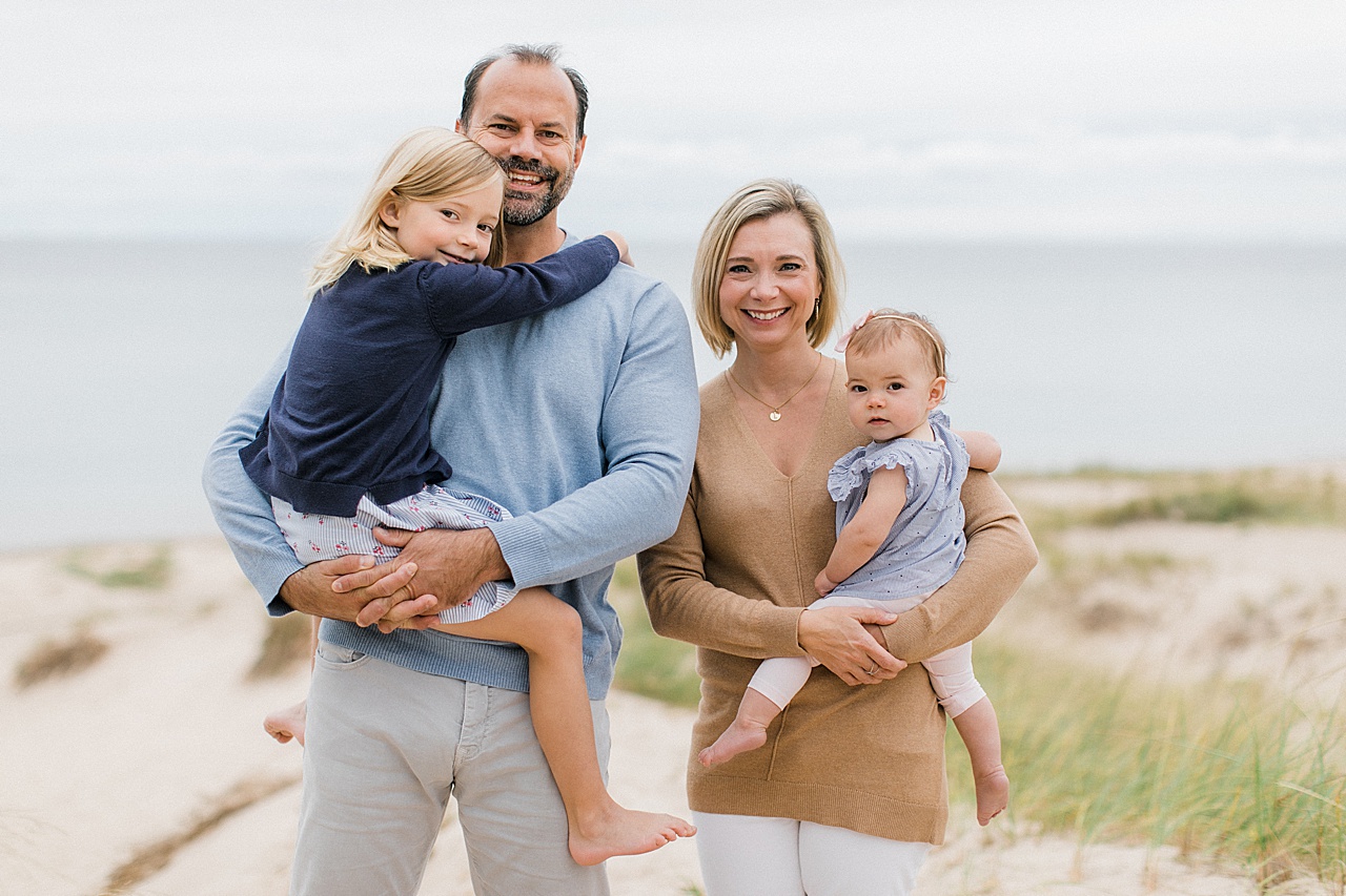 A family smiles for Northern Michigan family portraits in Charlevoix