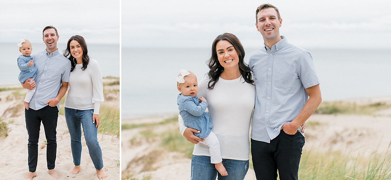 A man and woman pose for Northern Michigan family portraits with their baby girl