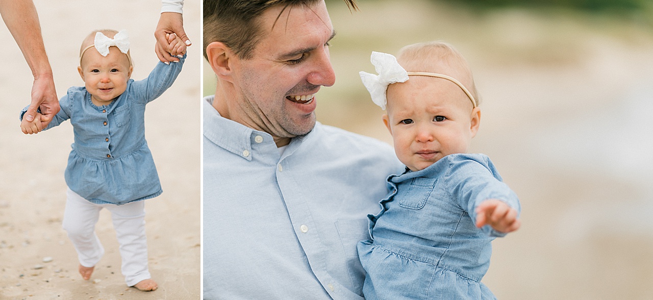 A father looks at his daughter and smiles at her while taking Northern Michigan family portraits