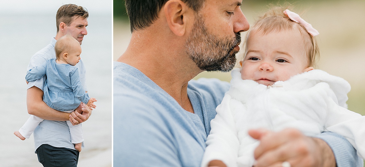 Two fathers hold their baby girls while dressed in blue in Michigan