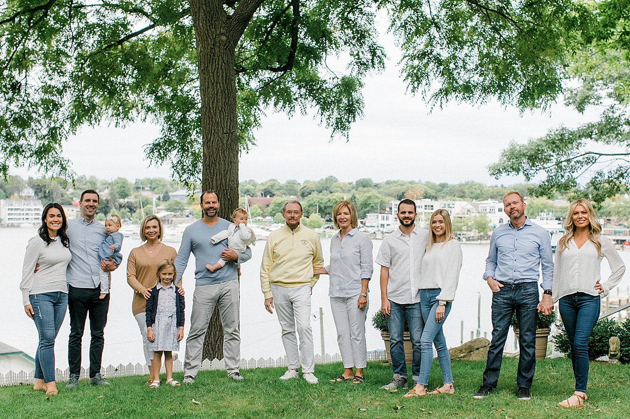 A family poses on a lawn in Charlevoix for Northern Michigan family portraits