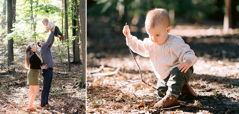A one year old boy playing with his parents in the woods in Michigan